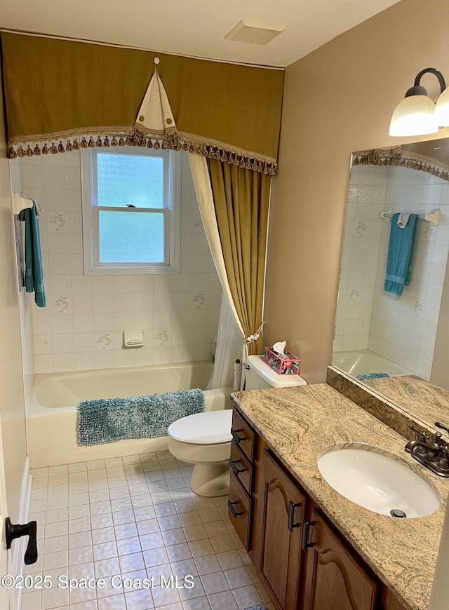 bathroom with vanity, visible vents, tile patterned flooring, shower / bath combination with curtain, and toilet