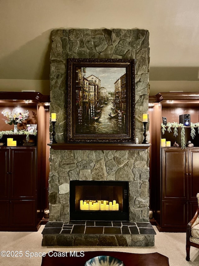 details featuring carpet flooring and a fireplace