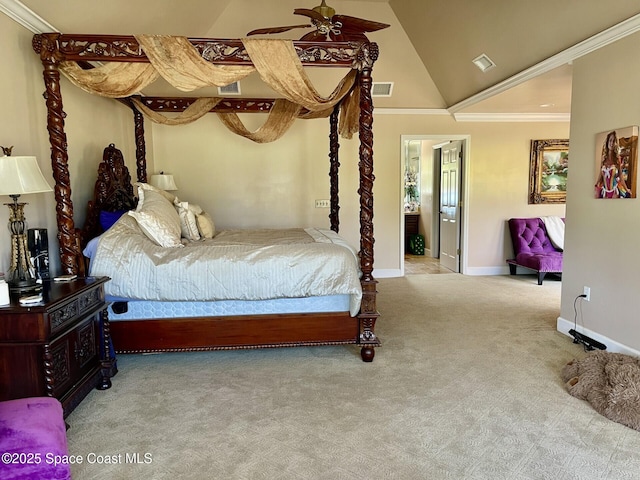 carpeted bedroom with visible vents, crown molding, baseboards, and vaulted ceiling