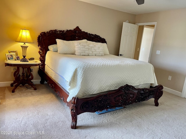 carpeted bedroom featuring ceiling fan and baseboards