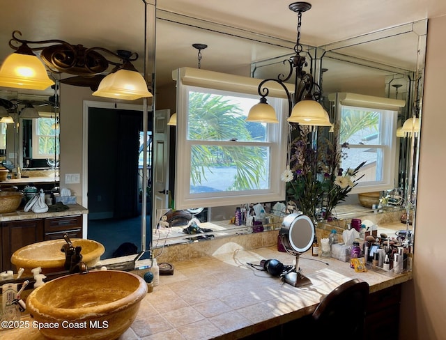 kitchen featuring pendant lighting and a healthy amount of sunlight