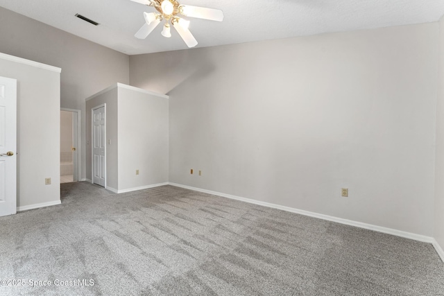 unfurnished room with baseboards, visible vents, lofted ceiling, ceiling fan, and carpet flooring