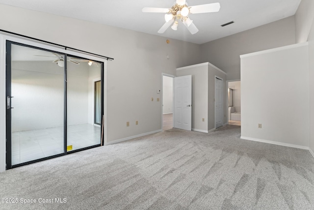 unfurnished bedroom with visible vents, connected bathroom, carpet, baseboards, and ceiling fan