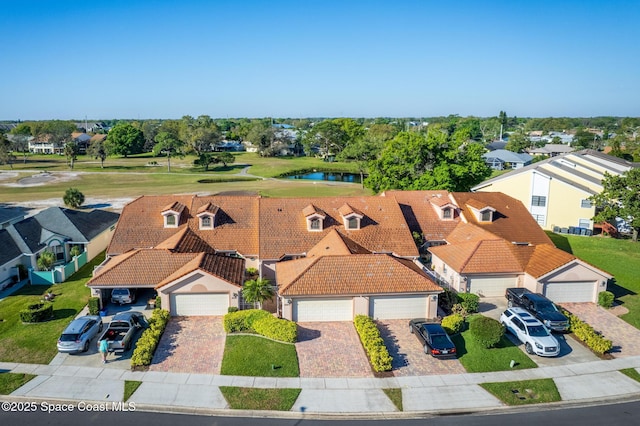 birds eye view of property featuring a residential view and a water view