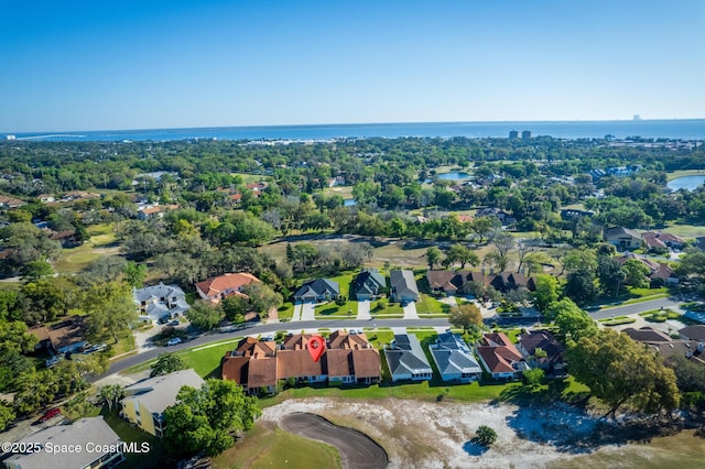 aerial view featuring a residential view and a water view