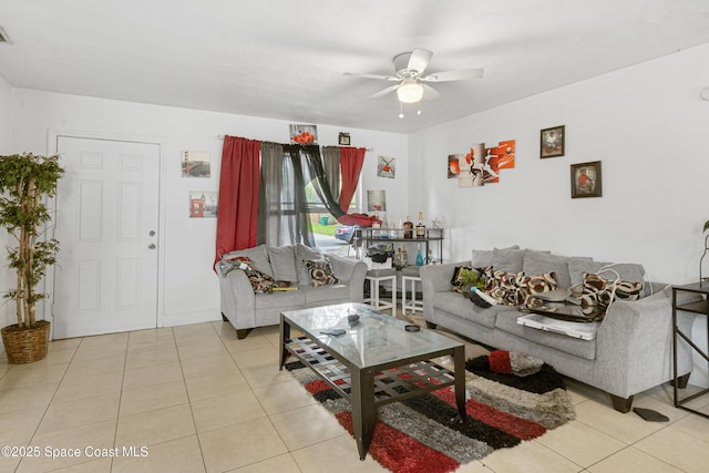 tiled living room featuring visible vents and a ceiling fan