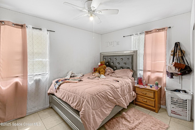 bedroom with light tile patterned floors and ceiling fan