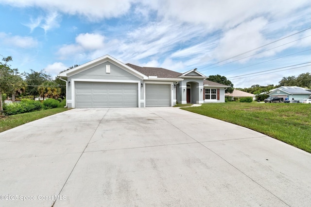 single story home featuring a front yard, an attached garage, concrete driveway, and stucco siding