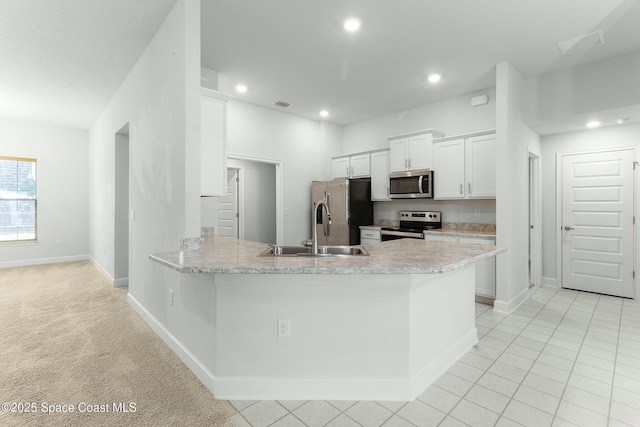 kitchen with visible vents, a sink, recessed lighting, appliances with stainless steel finishes, and white cabinets