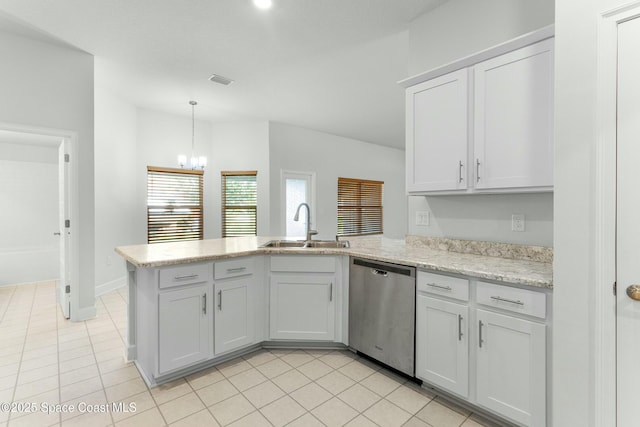 kitchen with pendant lighting, a peninsula, stainless steel dishwasher, an inviting chandelier, and a sink