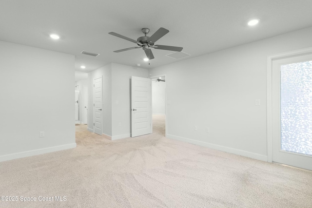 unfurnished bedroom featuring visible vents, recessed lighting, baseboards, and light carpet