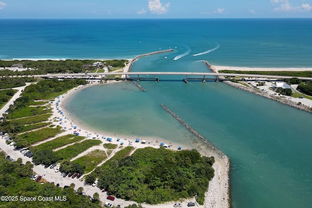 aerial view with a water view and a view of the beach