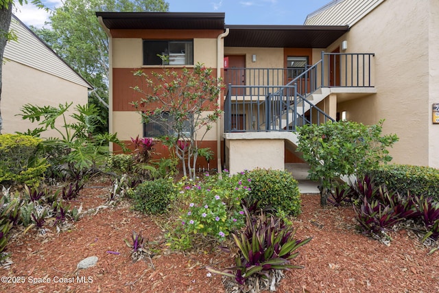 view of property featuring stairway