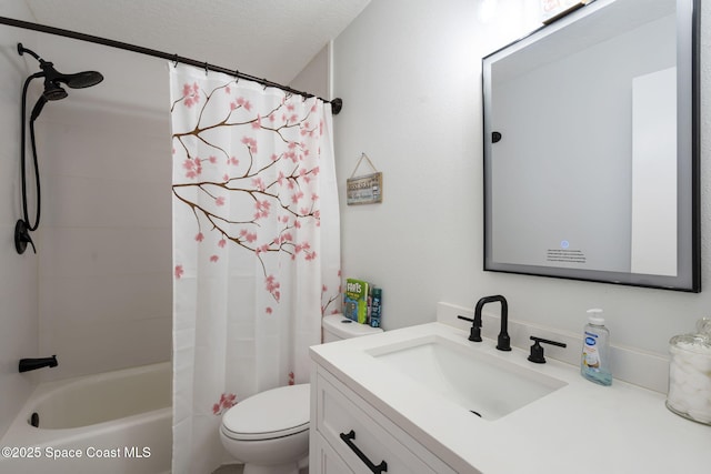 full bath featuring vanity, shower / tub combo, toilet, and a textured ceiling