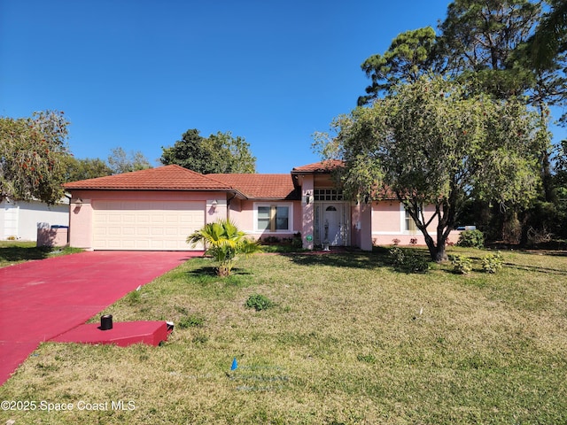 view of front facade featuring a front lawn, an attached garage, a tile roof, and stucco siding