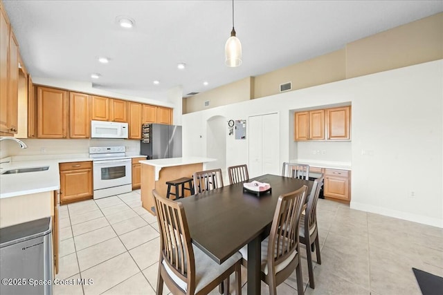 dining space with light tile patterned floors, visible vents, baseboards, and recessed lighting