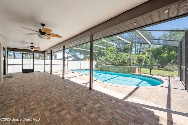 view of pool featuring a fenced in pool, ceiling fan, fence, glass enclosure, and a patio