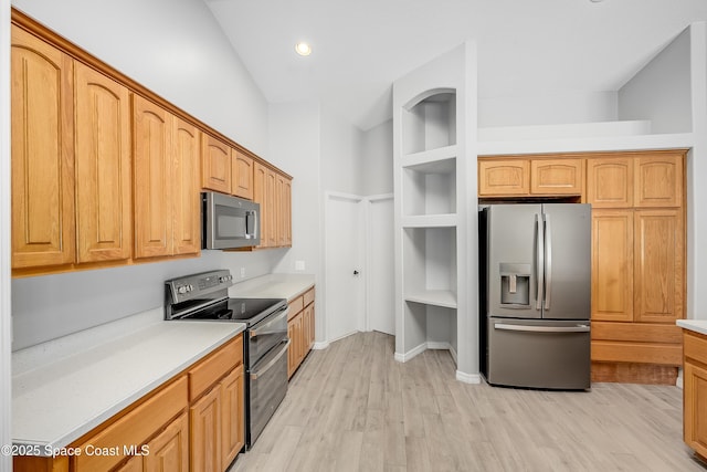 kitchen with light countertops, recessed lighting, light wood-style flooring, stainless steel appliances, and open shelves