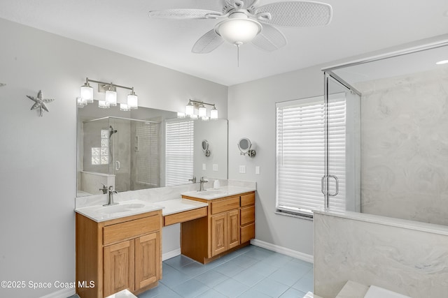 bathroom featuring tile patterned floors, a stall shower, a ceiling fan, baseboards, and vanity