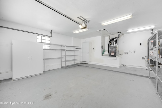 garage with heating unit and a garage door opener