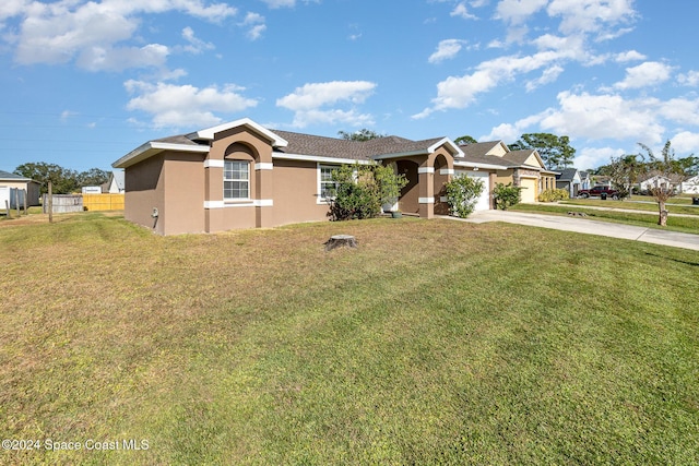 ranch-style house featuring stucco siding, a front lawn, fence, concrete driveway, and an attached garage