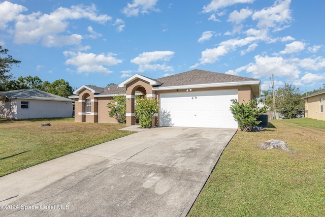 ranch-style home featuring a front yard, a garage, driveway, and stucco siding