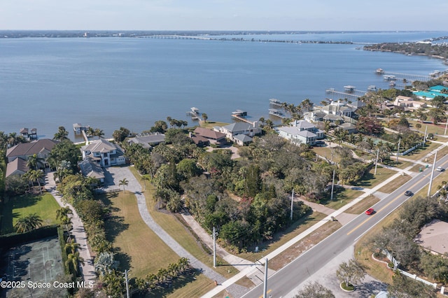 birds eye view of property featuring a water view and a residential view