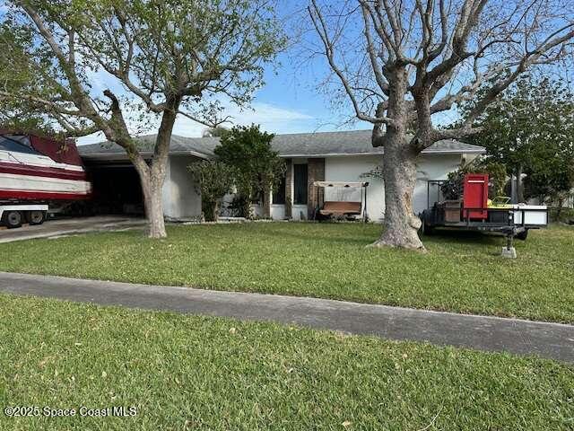 ranch-style house with a front yard