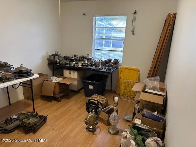 miscellaneous room featuring wood finished floors