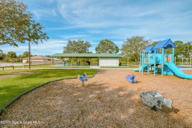 community play area featuring a lawn