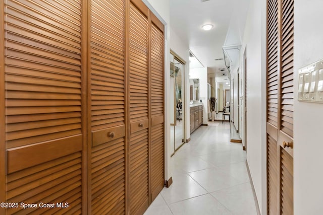 hallway featuring light tile patterned floors