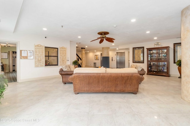 living area featuring recessed lighting, stairway, baseboards, and ceiling fan