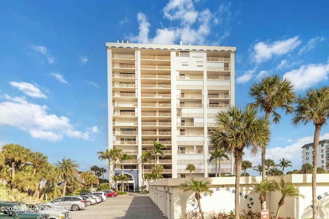 view of property featuring uncovered parking