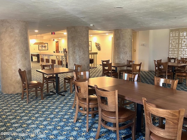 view of carpeted dining space