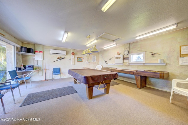 recreation room featuring a textured ceiling, billiards, and a wall unit AC