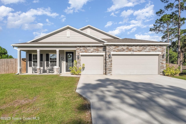 view of front of home with fence, covered porch, concrete driveway, a front yard, and a garage