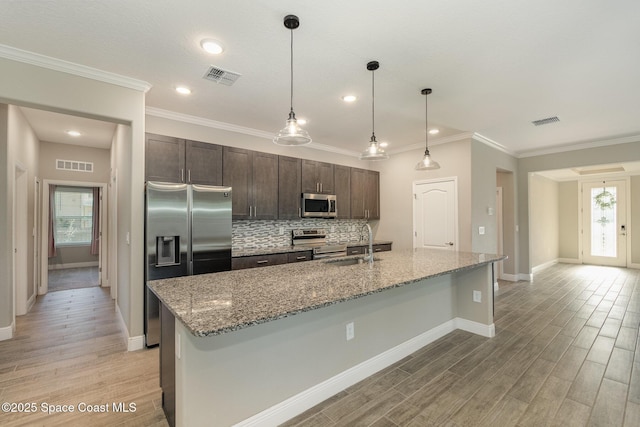 kitchen featuring a sink, stainless steel appliances, and visible vents