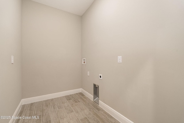 washroom featuring light wood finished floors, baseboards, washer hookup, laundry area, and hookup for an electric dryer