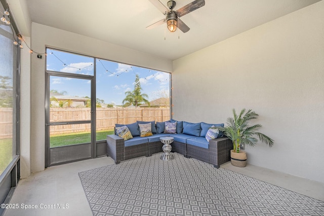 sunroom with ceiling fan