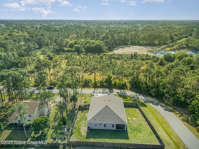 aerial view featuring a wooded view