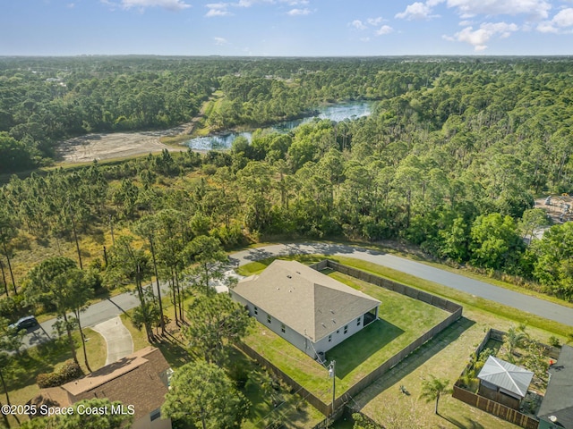 aerial view with a forest view and a water view