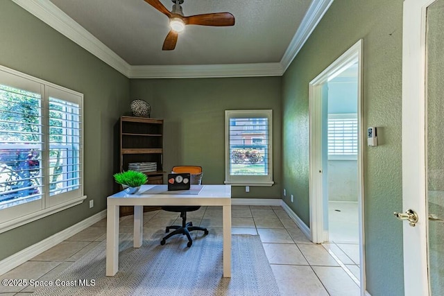 office area with light tile patterned floors, baseboards, a ceiling fan, and crown molding