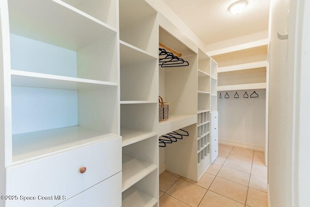 walk in closet featuring light tile patterned floors