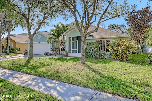 view of front of home with stucco siding, driveway, an attached garage, and a front yard