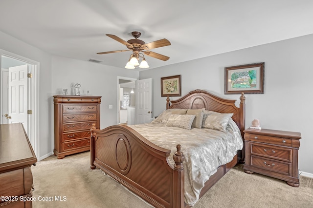 bedroom with visible vents, light carpet, baseboards, and ceiling fan