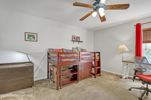 bedroom featuring baseboards, carpet floors, and ceiling fan