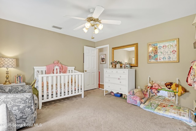 bedroom with a ceiling fan, carpet, and visible vents