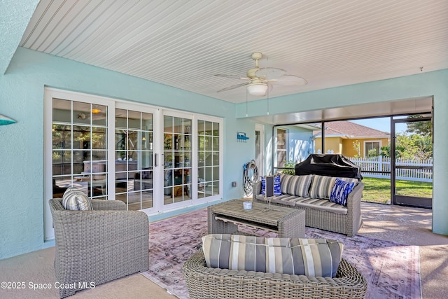 exterior space featuring area for grilling, an outdoor hangout area, a ceiling fan, and fence