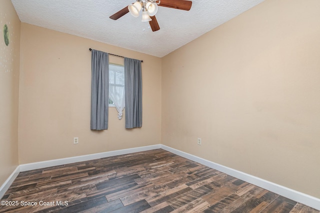 empty room featuring baseboards, a textured ceiling, dark wood finished floors, and a ceiling fan