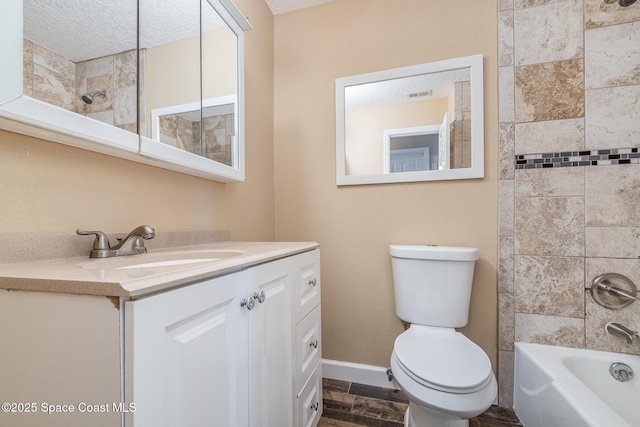 bathroom with visible vents, baseboards, toilet, vanity, and  shower combination